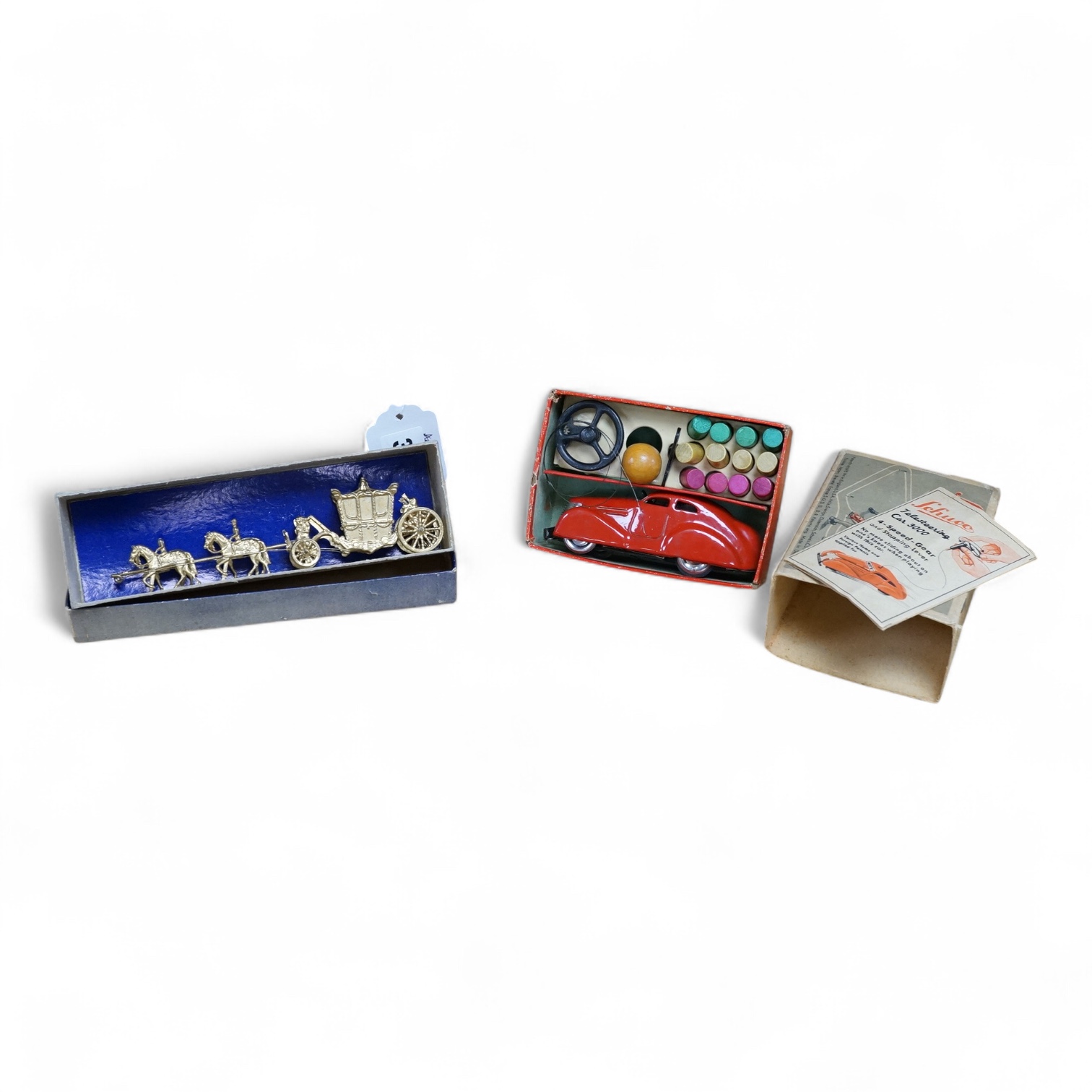 A boxed Britains Miniature Coronation Coach (1478) and a boxed Schuco Telesteering Car 3000 with accessories and instruction leaflet. Condition - good.